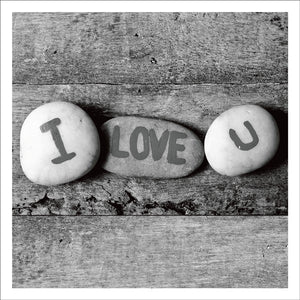 Card With Three Pebbles With I Love You Written On Them 