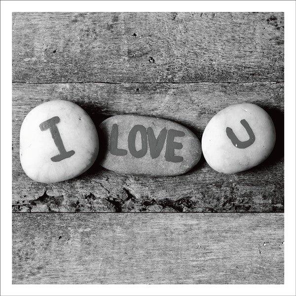 Card With Three Pebbles With I Love You Written On Them 